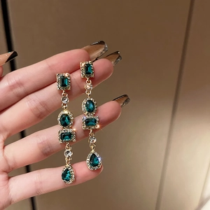 Vintage emerald crystal drop earrings with sparkling rhinestones in gold setting