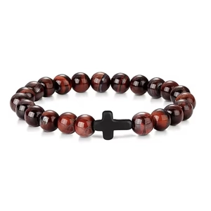 Detailed macro view of 8mm red tiger eye beads with a matte black cross pendant