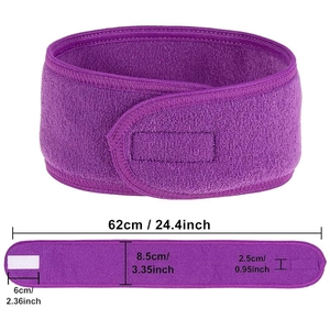 Detail view of purple velcro spa headband showing 62cm length and soft fabric texture