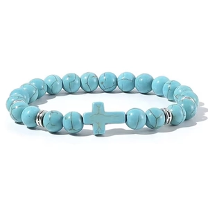 Macro detail of blue turquoise beads and silver metal spacers on a cross beaded bracelet