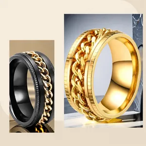 Close-up of a rotating stainless steel chain ring for men in gold and black colors.
