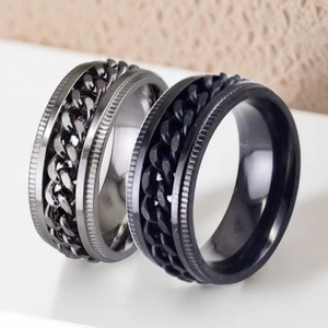 Close-up of stainless steel black and silver chain spinner rings for stress relief