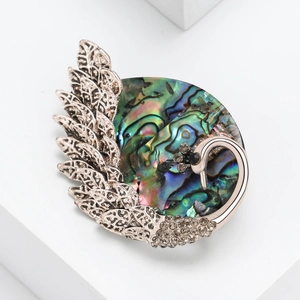 Elegant swan brooch with vintage metal wings and colorful iridescent abalone shell inlay