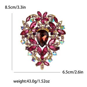 Detailed macro view of large flower brooch with red crystals and sizing dimensions