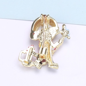 Macro shot of the gold metal pin back with textured surface and secure safety clasp