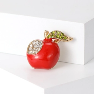 Broche pomme rouge étincelante avec strass verts et base en métal doré élégante