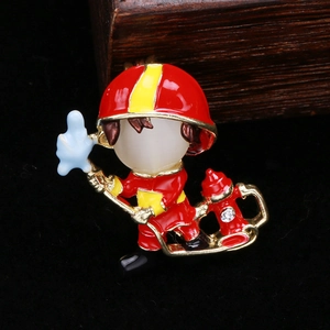 Macro view of firefighter brooch with enamel finish and sparkling rhinestone hydrant
