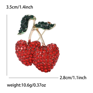 Sparkly red cherry brooch with green leaves and rhinestones, size 3.5cm by 2.8cm