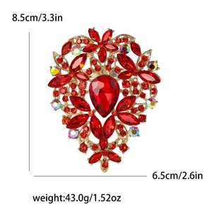 Exquisite large vintage rhinestone flower brooch with red pear-cut gems and gold-tone finish
