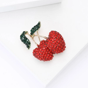 Elegant cherry brooch with red and green rhinestones in gold alloy finish for suits