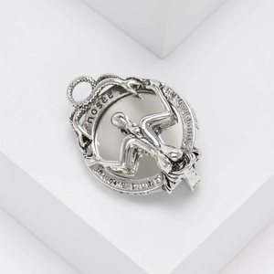 Retro silver pendant with Latin engraving and artistic human figure on white blocks