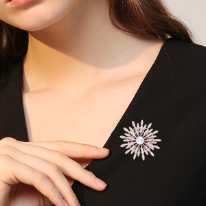 Luxury sunflower brooch with white pearl and crystals on black v-neck suit jacket