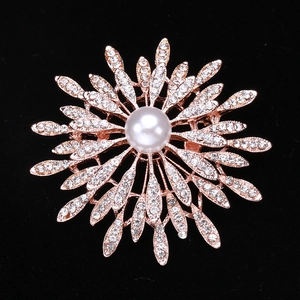 Luxury sunflower brooch in rose gold with white pearl and shimmering crystals