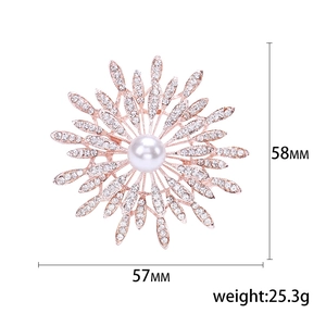 Luxurious sunflower brooch with white rhinestones and large white pearl in rose gold