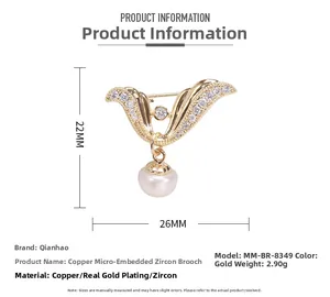 Macro detail of angel wing pearl brooch showing dimensions 22mm by 26mm and zircon stones