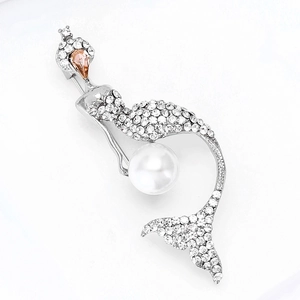 Detailed view of silver mermaid brooch with large white pearl and sparkling rhinestones