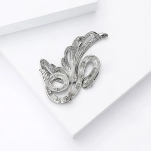 Back view of silver angel snake brooch showing detailed pin clasp on geometric block