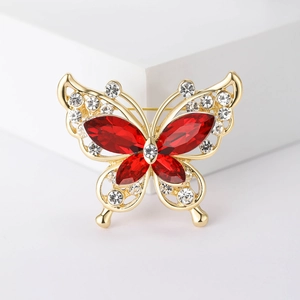 Fashionable butterfly brooch with red crystal wings and sparkling white rhinestones