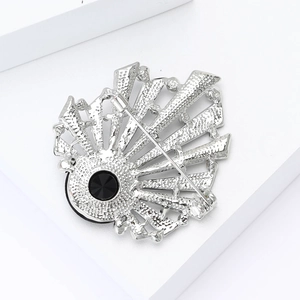 Detailed back view of silver alloy shell brooch with secure pin clasp and black stone