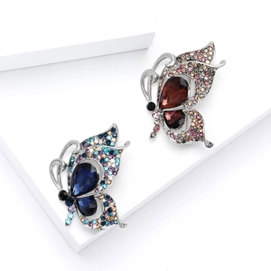 Elegant butterfly brooches with blue and red teardrop crystals and sparkling rhinestones