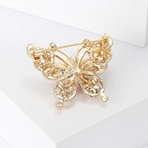 Back view of gold butterfly rhinestone brooch showing pin closure and alloy craft