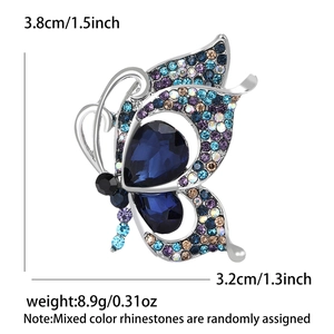 Detailed size view of silver butterfly brooch with colorful rhinestones and blue crystals