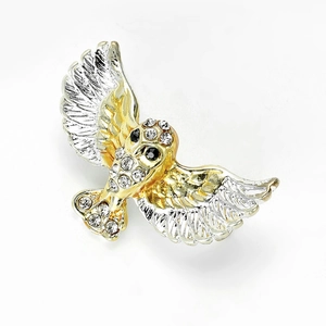 Exquisite eagle brooch in gold and silver tones with sparkling crystal rhinestones