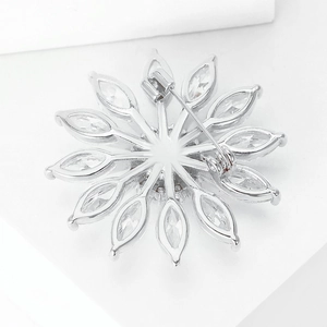 Detailed back view of a copper zircon daisy brooch with a secure long pin fastener