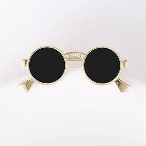 Detail of round sunglasses brooch with gold plating and clear zircon inlay decoration