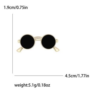 Creative gold-plated sunglasses brooch with black enamel and zircon accents for outfits