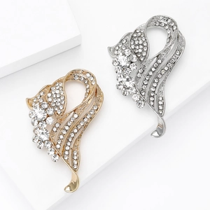 Elegant pair of sparkling crystal rhinestone brooches in gold and silver finish