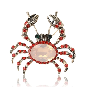 Exquisite crab brooch in vintage gold alloy with red rhinestones and opal stone center