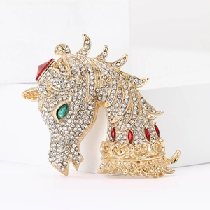 Exquisite horse head brooch in gold alloy with clear rhinestones and green gemstone eyes