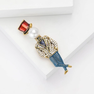 Close-up of a magician brooch with red hat, white pearl head and colorful rhinestones