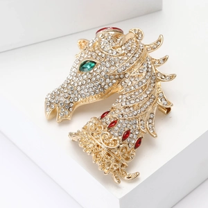Elegant gold-tone horse head brooch with sparkling white, red, and green rhinestones