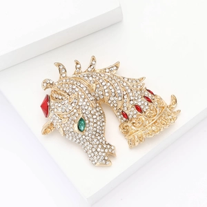 Elegant gold horse head brooch with white rhinestones and red green gemstone accents