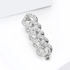 Silver luxury chain brooch with sparkling white rhinestones on a minimalist white backdrop