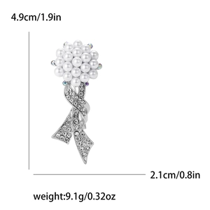 Detailed size view of ribbon pearl brooch with rhinestones showing 4.9cm by 2.1cm dimensions