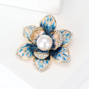 Elegant floral enamel brooch with blue pink gradient petals and a large center pearl