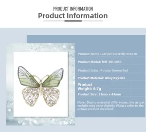 Detailed view of rhinestone butterfly brooch showing 33mm by 43mm size and material specs
