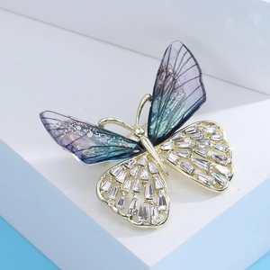 Detail showing gradient blue purple wings and crystal inlay on the butterfly brooch