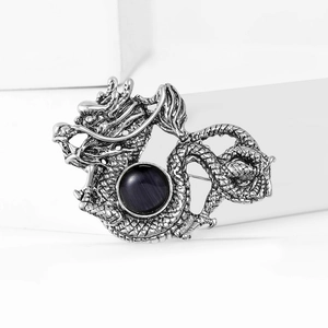 Vintage silver dragon brooch with dragon scales and centered dark gemstone for men suit