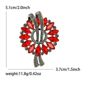 Vintage marquise crystal floral brooch in gold alloy with ruby red stones, 5.1cm by 3.7cm