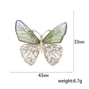 Elegant butterfly brooch with gradient wings and crystals measuring 43mm wide by 33mm high