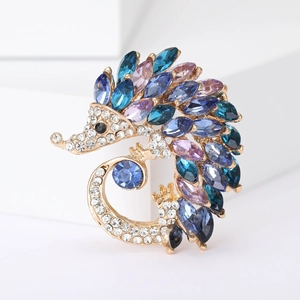 Exquisite hedgehog crystal brooch with blue and purple rhinestones on white display