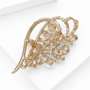 Elegant gold-plated hollow leaf brooch featuring white pearls and secure pin fastening