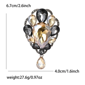 Retro crystal brooch with grey and amber stones showing dimensions 6.7cm x 4.0cm
