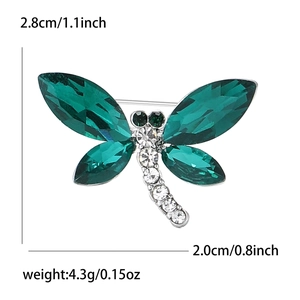 Broche libellule en cristal vert et alliage argenté de taille 2,8cm sur 2,0cm