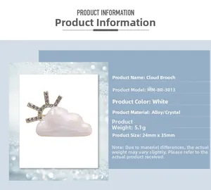 Detailed view of white cloud and sun brooch with alloy materials and rhinestone inlay