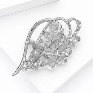 Close-up of the silver alloy leaf brooch back with sandblasted finish and pin clasp